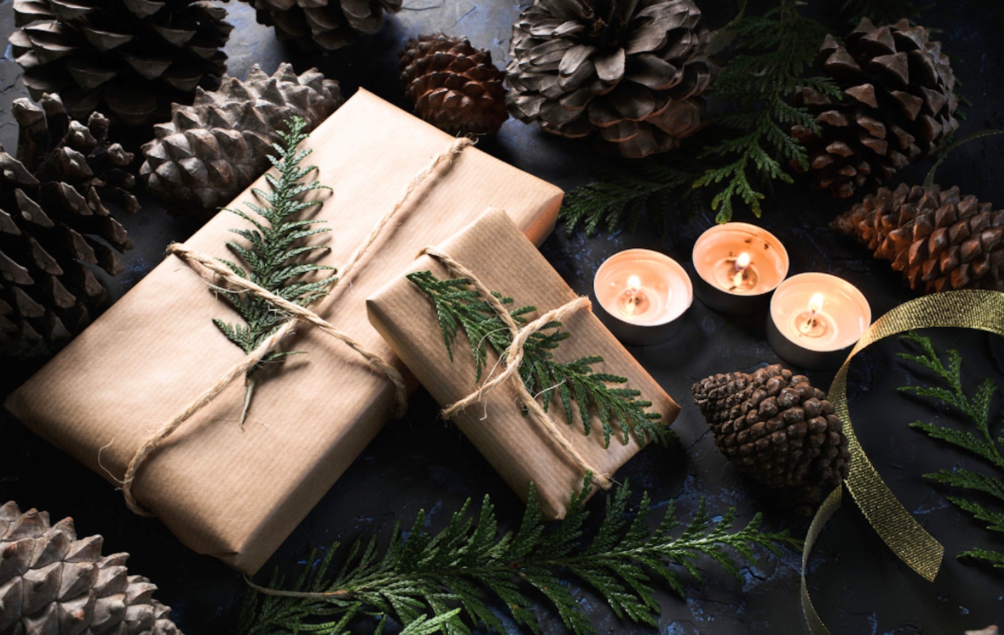 wrapped gifts with acorns and candles